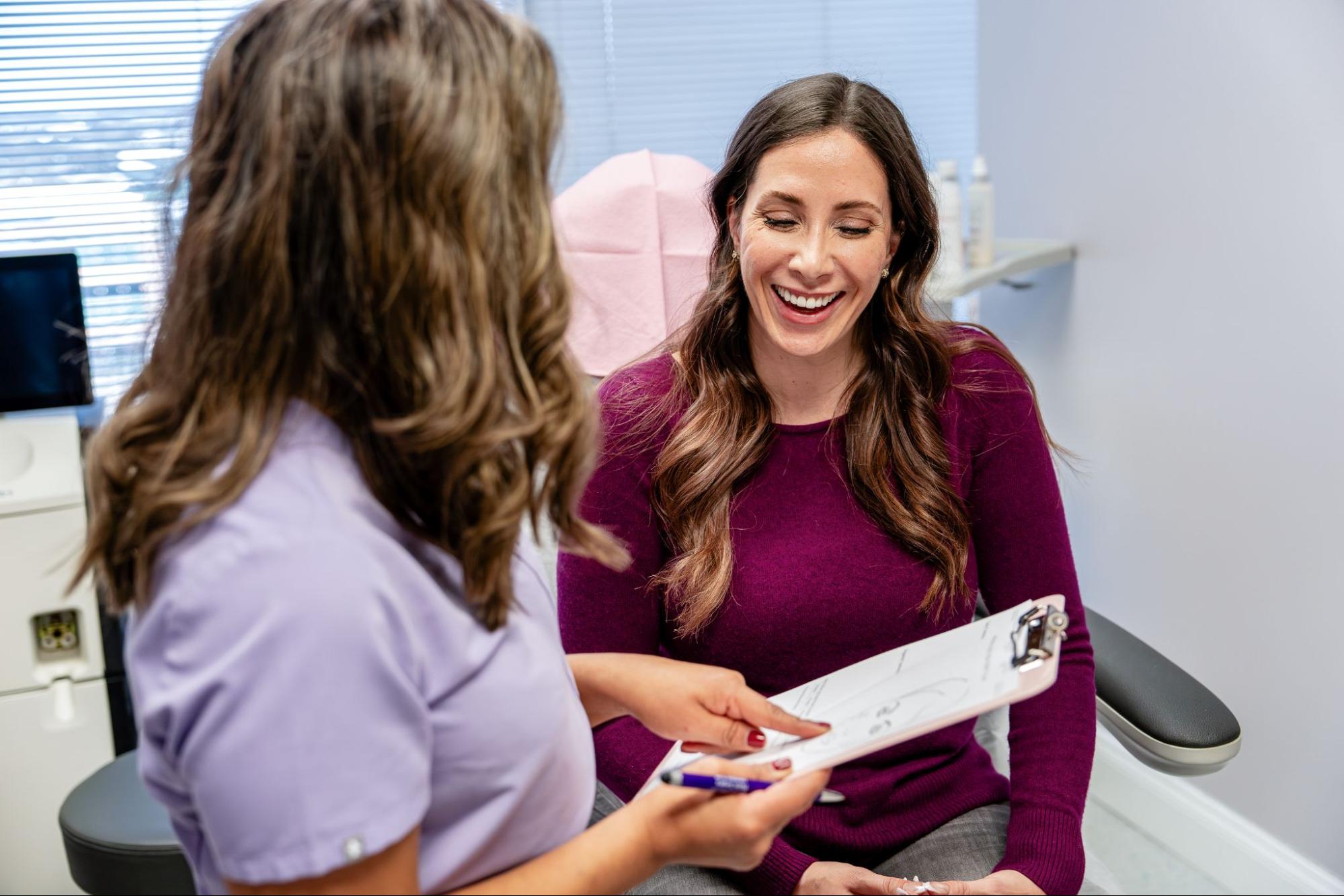 Laser hair removal patient interaction in Alexandria Nurse assisting patient during laser hair removal visit in Alexandria